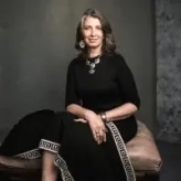 gabriela sitting on a stool