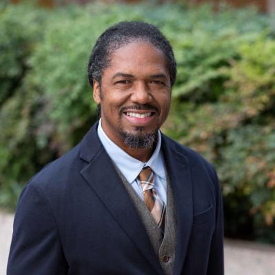 Picture of Marcus Walton, an african american man in a suit smiling